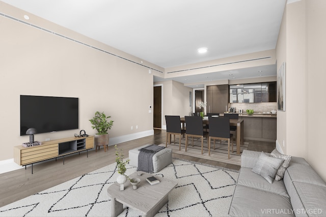 172 Madison Ave Unit 4B, New York City, NY 10016 - living area with wood finished floors, baseboards, and recessed lighting