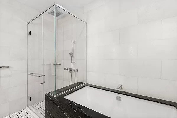 full bathroom featuring a shower stall