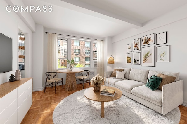 living room featuring beamed ceiling