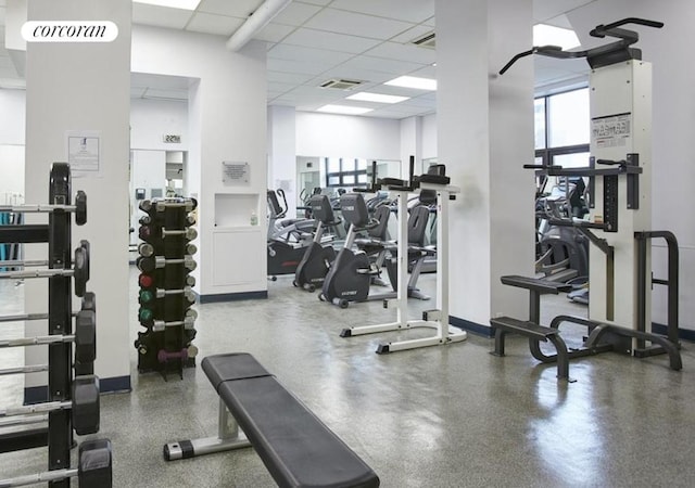 exercise room featuring a drop ceiling