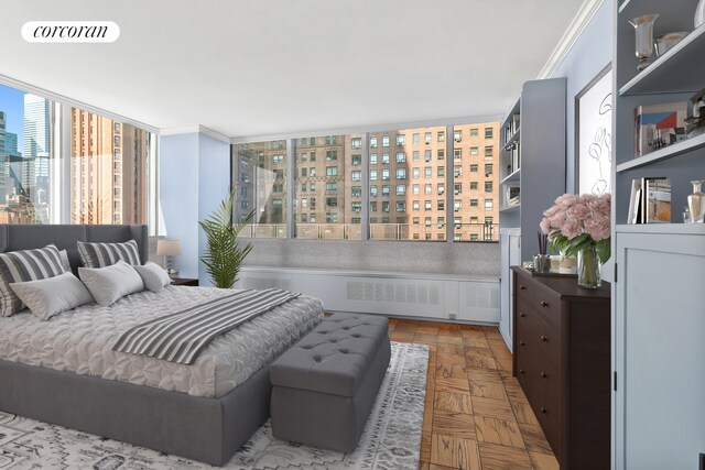 bedroom with a view of city and crown molding