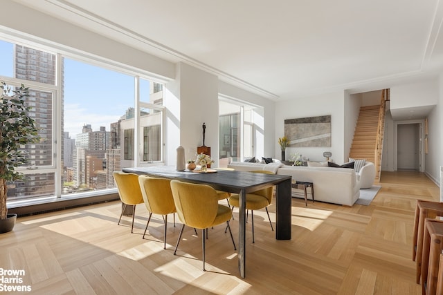 dining space with a view of city and stairway