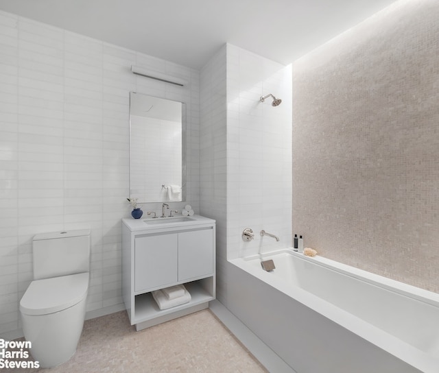 full bath featuring toilet, vanity, tile walls, and shower / bathing tub combination