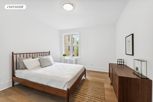 bedroom with hardwood / wood-style flooring