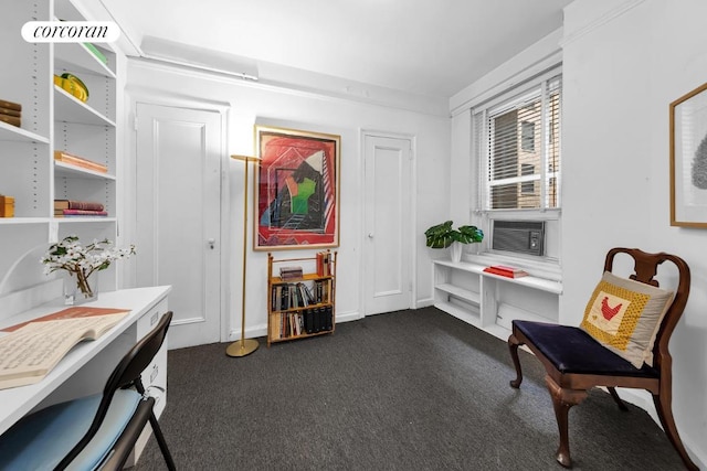 living area with dark carpet