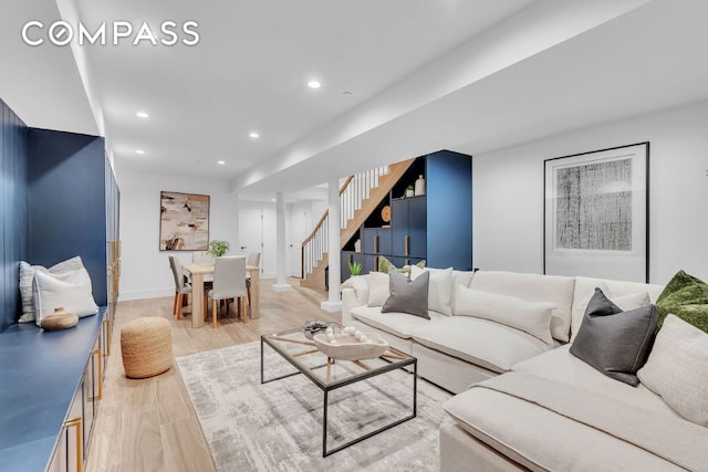 living room with light hardwood / wood-style flooring