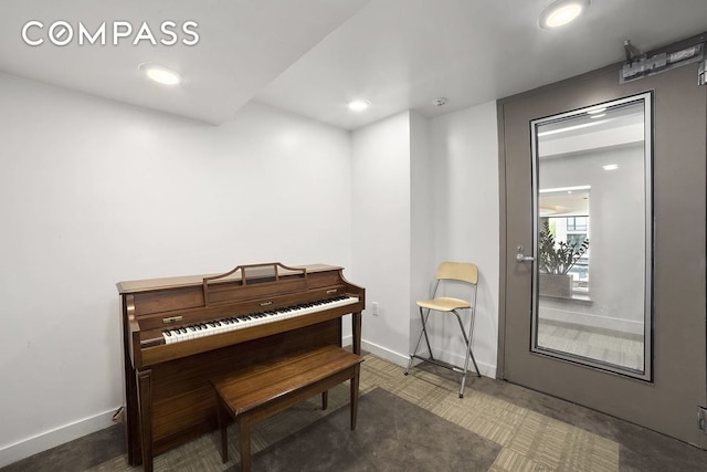 living area with baseboards and recessed lighting