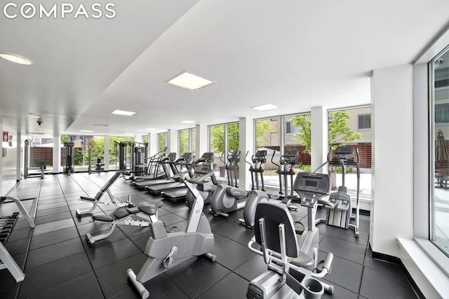 gym with plenty of natural light and floor to ceiling windows