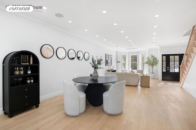 dining space with recessed lighting, visible vents, stairway, light wood-style floors, and baseboards