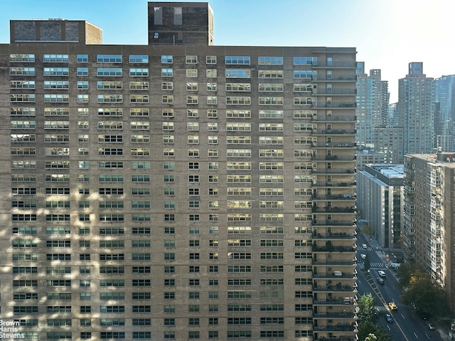 view of building exterior featuring a city view