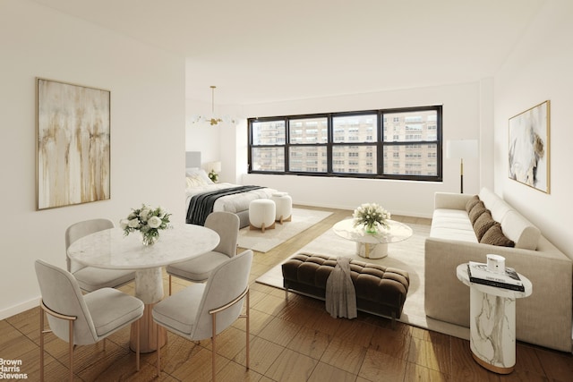 bedroom with a chandelier, baseboards, and wood finished floors