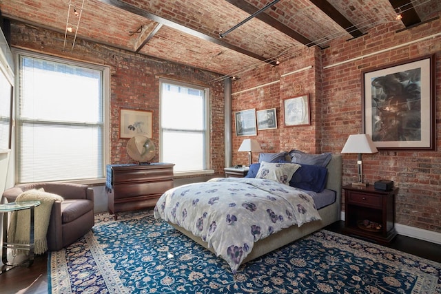 176 Duane St Unit 4, New York City, NY 10013 - bedroom featuring brick ceiling, brick wall, and wood finished floors