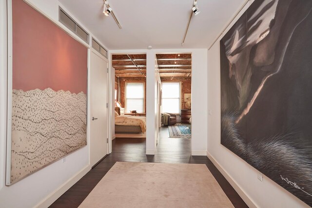 hall featuring dark wood finished floors and baseboards
