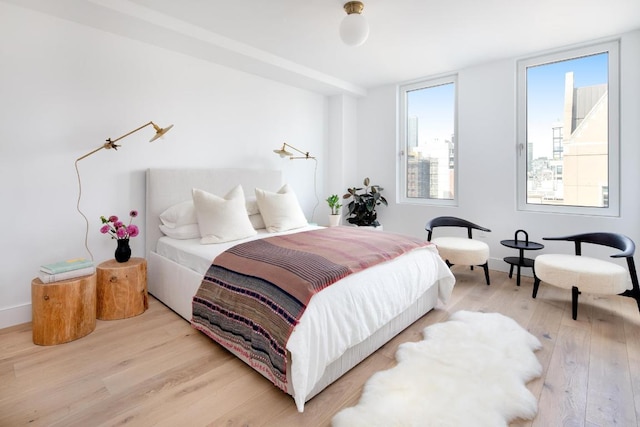 bedroom with light hardwood / wood-style flooring