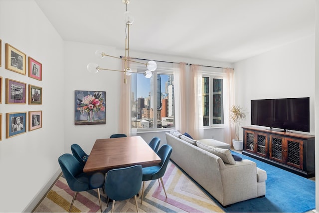 dining area featuring a notable chandelier