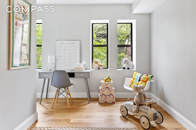 office area with wood finished floors and baseboards