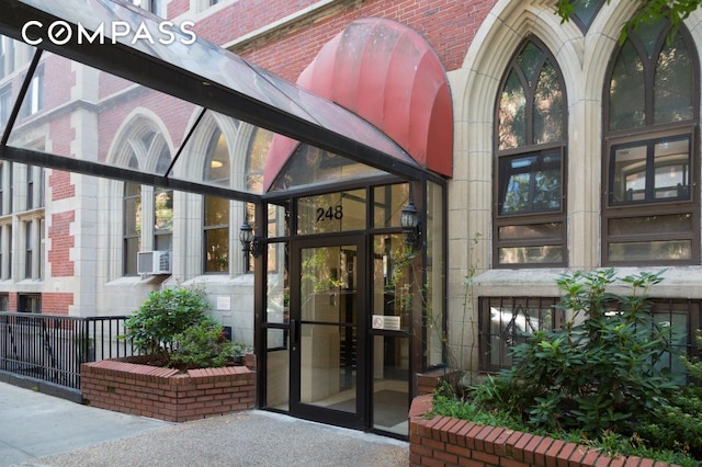 property entrance with brick siding