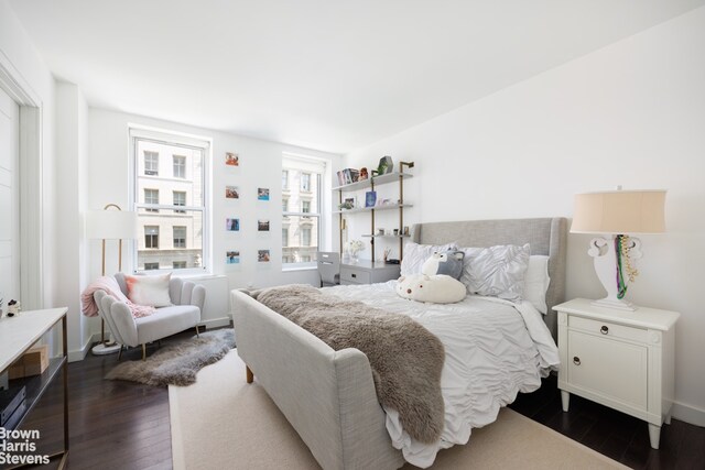 bedroom featuring dark hardwood / wood-style flooring