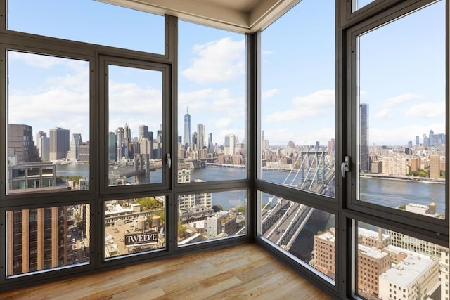 unfurnished sunroom with a water view