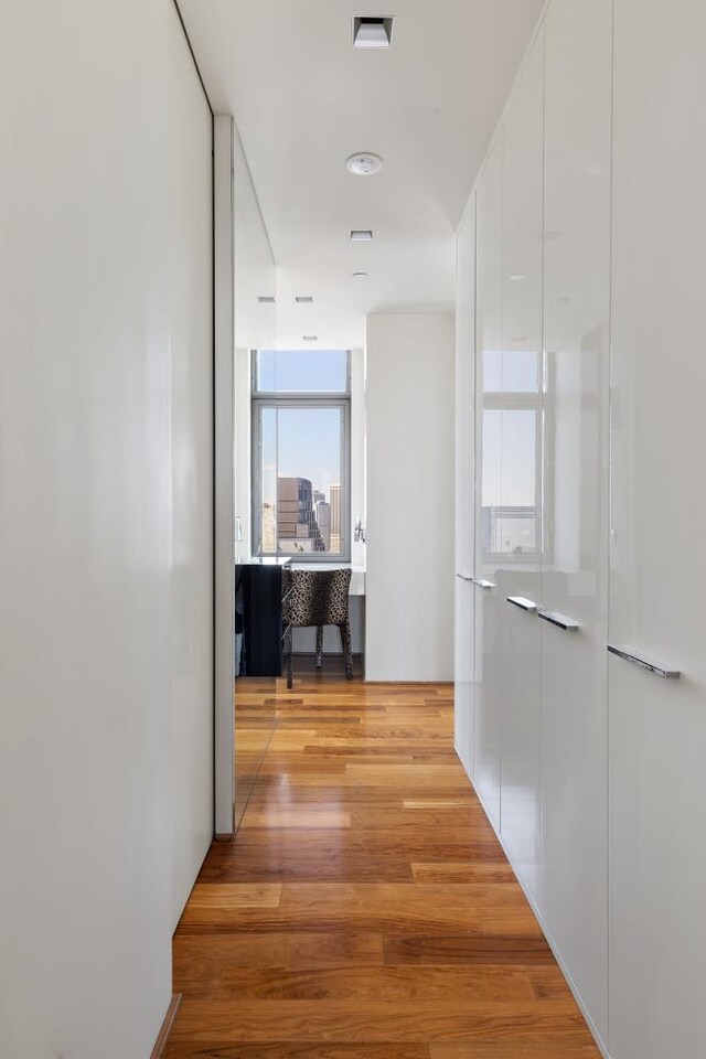 bathroom featuring hardwood / wood-style flooring, sink, and toilet