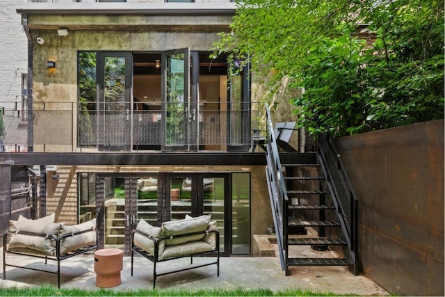 exterior space featuring outdoor lounge area and french doors