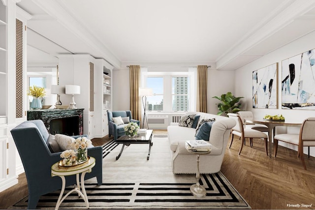 sitting room featuring parquet flooring and ornamental molding