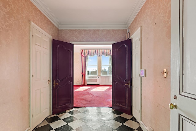 entrance foyer with ornamental molding and tile patterned floors