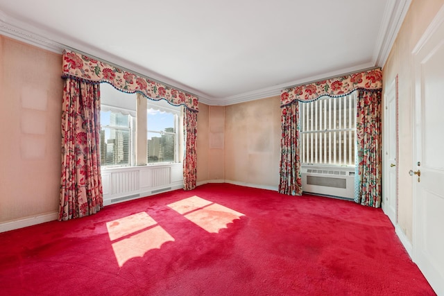 empty room with carpet, baseboards, and crown molding