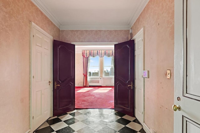 carpeted entrance foyer with ornamental molding