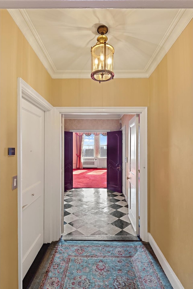 interior space with ornamental molding, a chandelier, baseboards, and a wall mounted AC