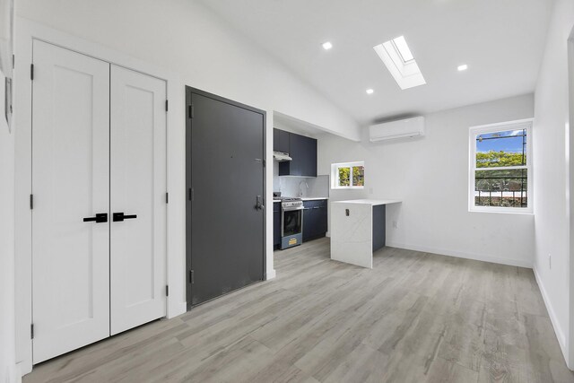 corridor featuring electric panel and light hardwood / wood-style floors