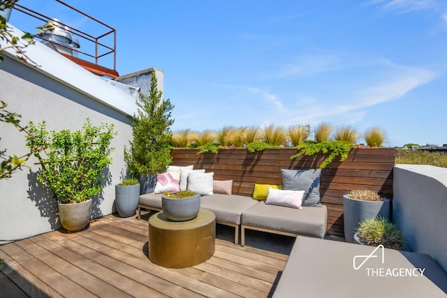 deck with an outdoor hangout area