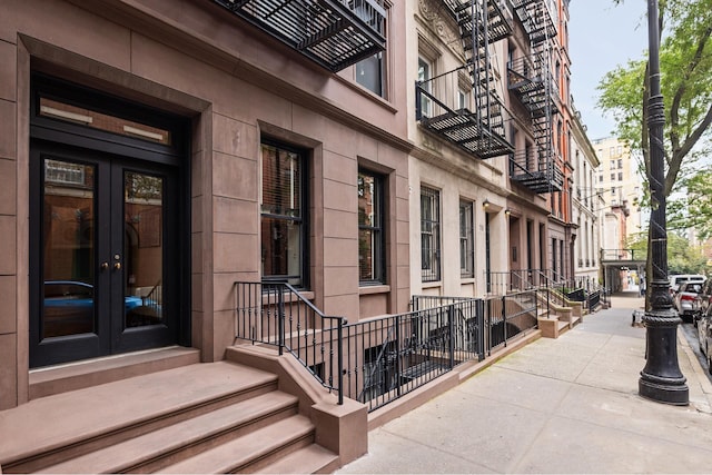 view of exterior entry featuring french doors