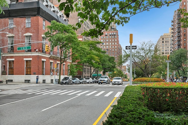 view of street featuring curbs and street lighting