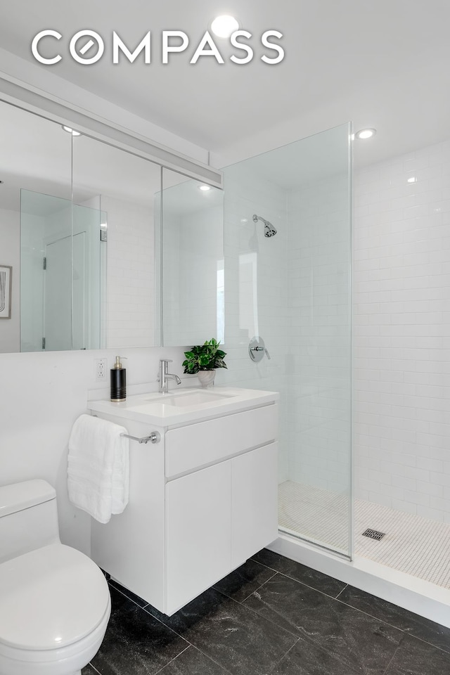 425 W 53rd St Unit 419, New York City, NY 10019 - full bathroom with vanity, a shower stall, and toilet