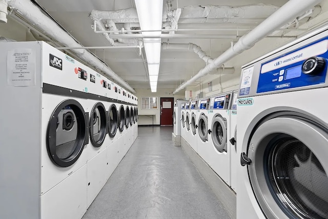community laundry room with washer and clothes dryer