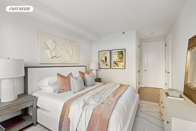 bedroom with wood finished floors and visible vents