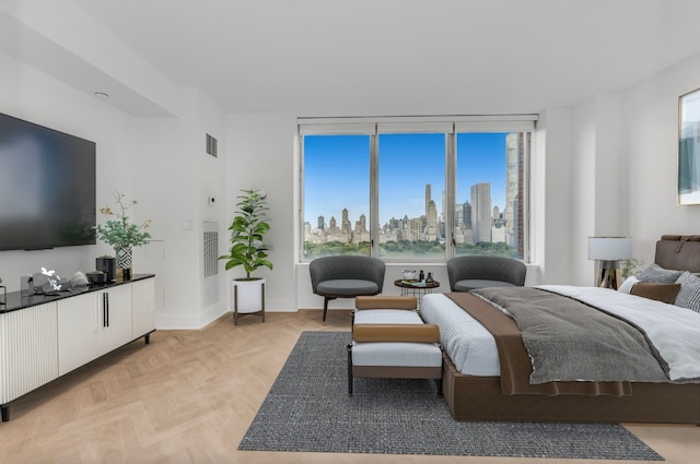 bedroom with light parquet floors