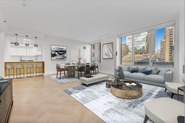 15 W 63rd St Unit 17-A, New York City, NY 10023 - living room featuring rail lighting and baseboards