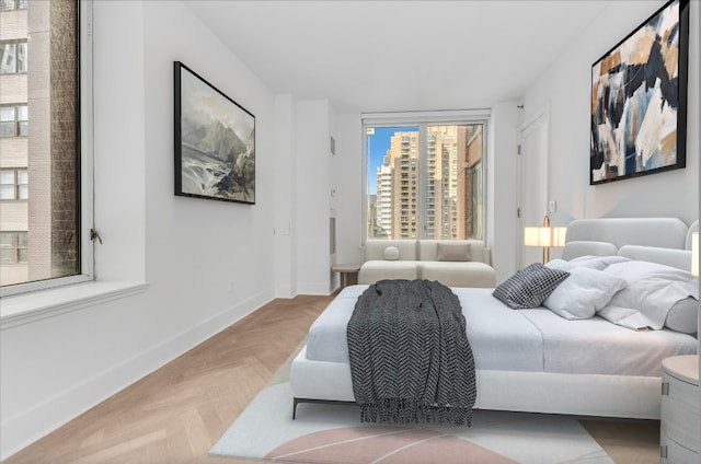 bedroom with light parquet floors