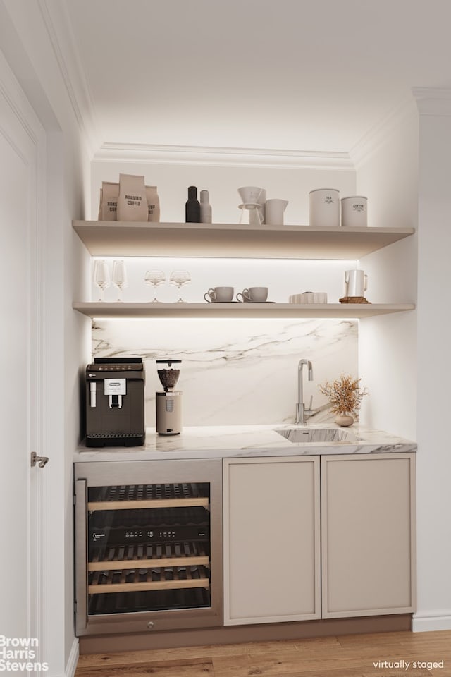 888 Park Avenue Maisonette, New York City, NY 10075 - bar with beverage cooler, wet bar, ornamental molding, and a sink