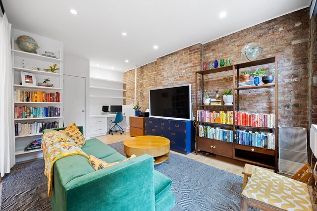 living room featuring an inviting chandelier, hardwood / wood-style floors, cooling unit, and plenty of natural light