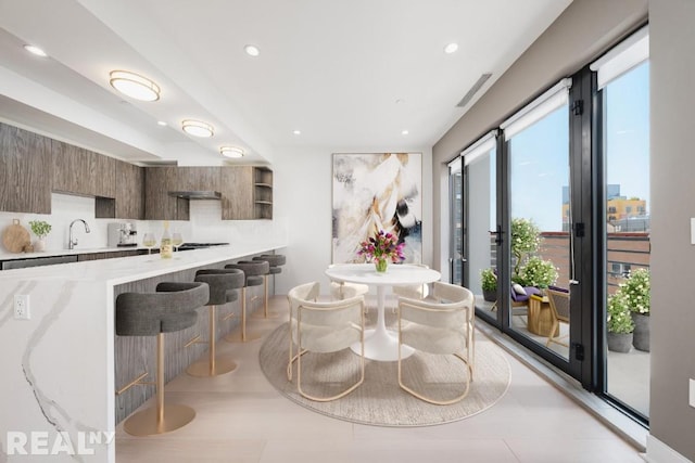 dining room featuring recessed lighting