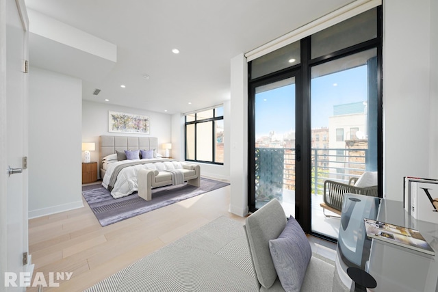 bedroom with visible vents, baseboards, wood finished floors, access to exterior, and recessed lighting