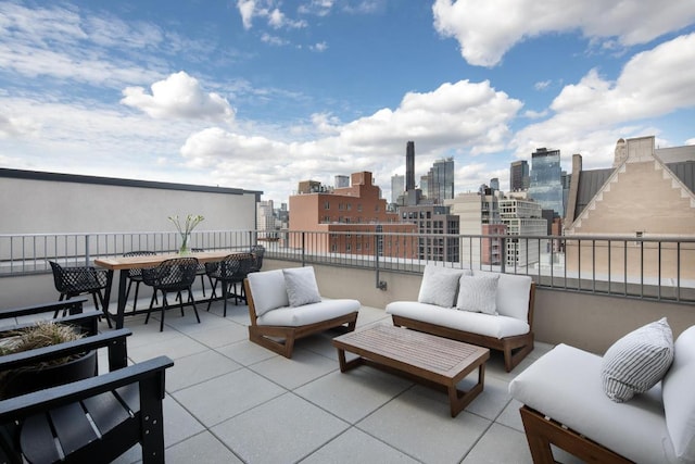 view of patio / terrace with a balcony and outdoor lounge area