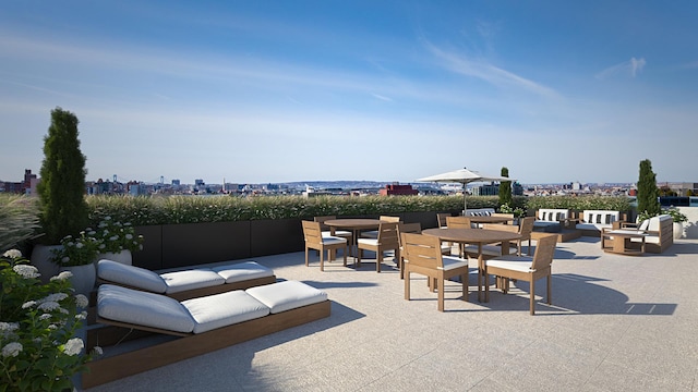 view of patio with outdoor dining area, an outdoor hangout area, and a view of city