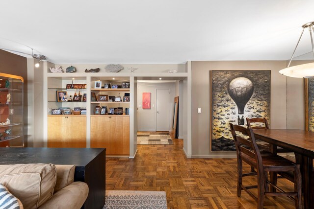 dining room featuring light parquet floors