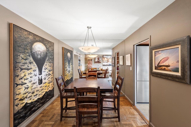 dining room featuring baseboards