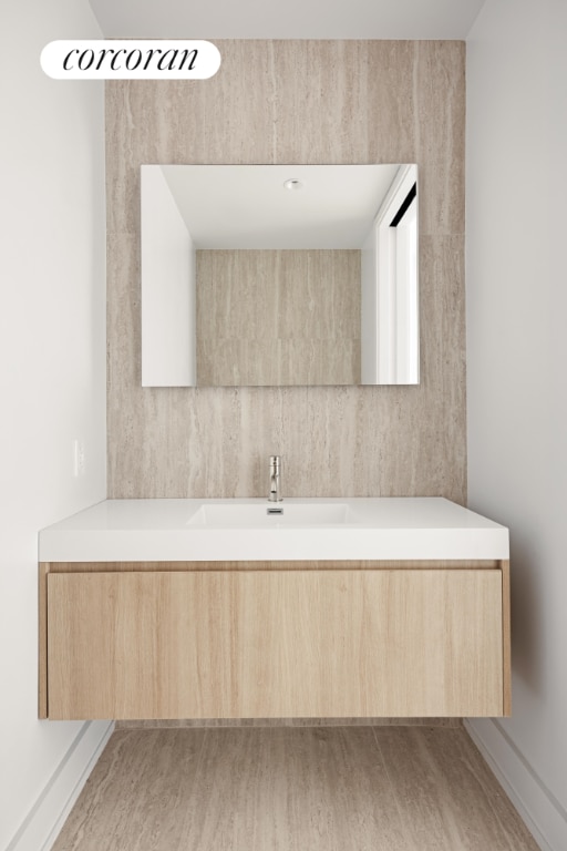 bathroom featuring wood-type flooring and vanity