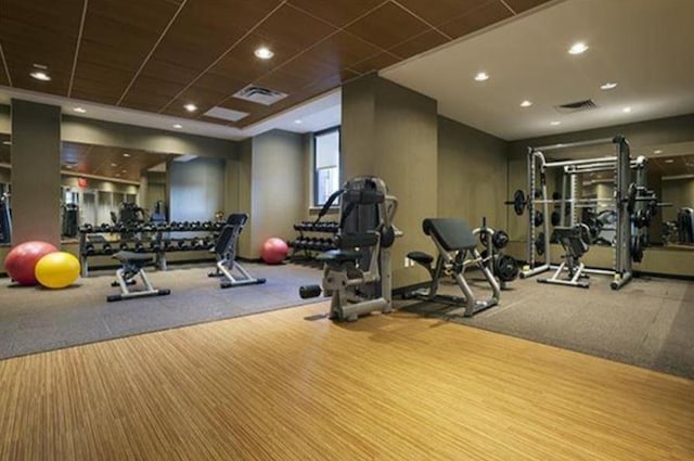 workout area featuring recessed lighting and visible vents